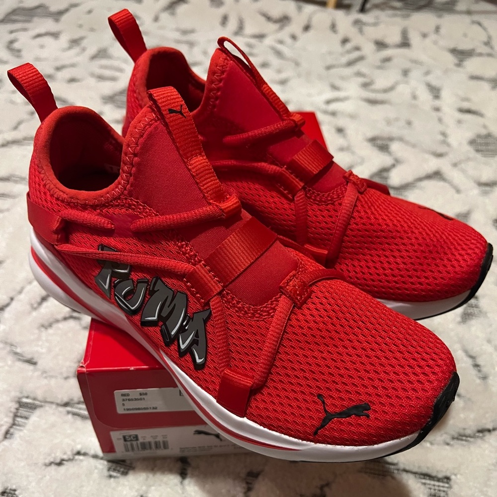 New. Never worn. Puma kid shoes size 5.